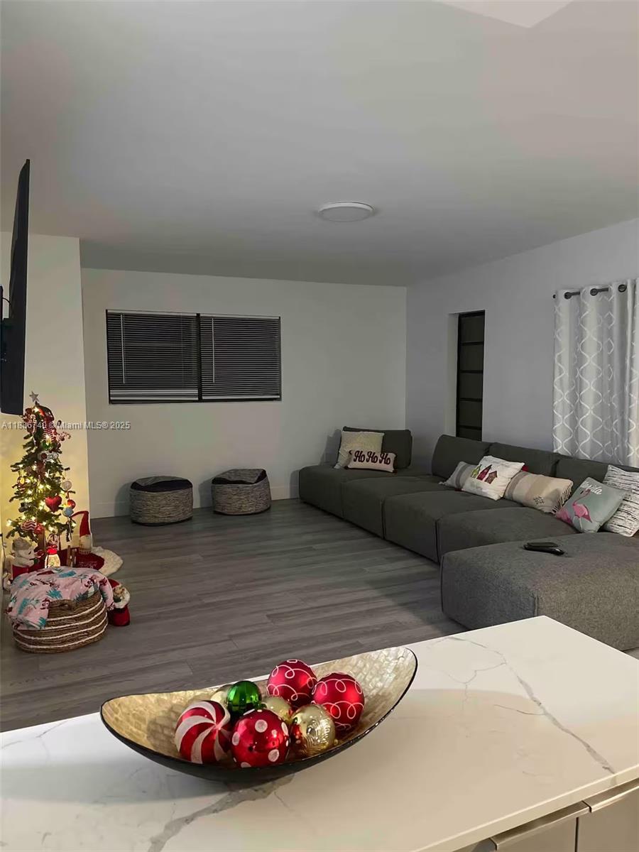 237 2nd Road Key Largo, FL 33037 - Photo 3 of 11 a living room with furniture and a flat screen tv