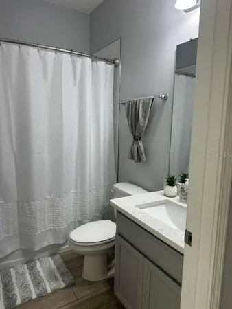 a bathroom with a sink and toilet