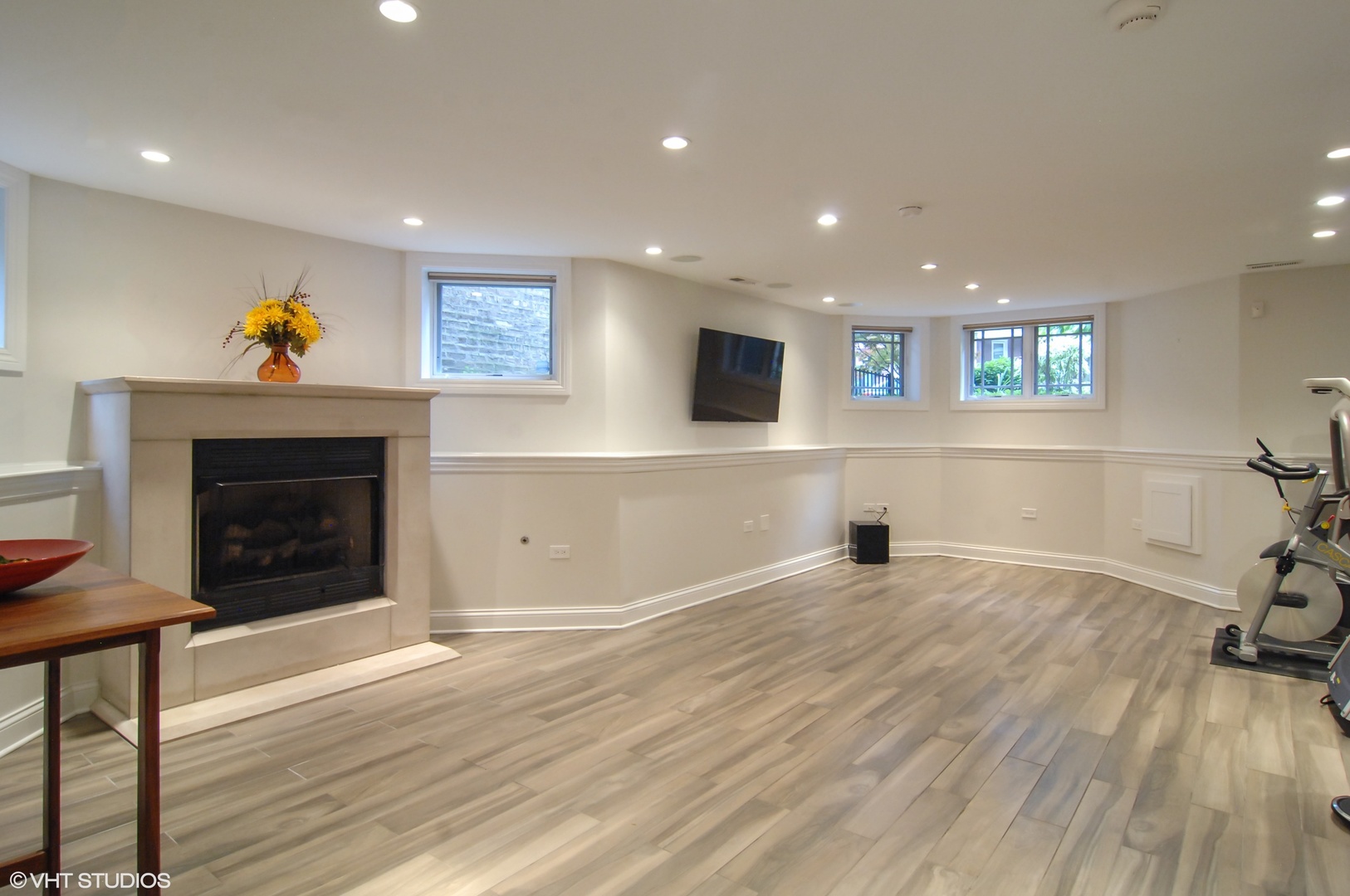 Undisclosed Address Chicago, IL 60618 - Photo 14 of 31 a view of an empty room with wooden floor and a fireplace