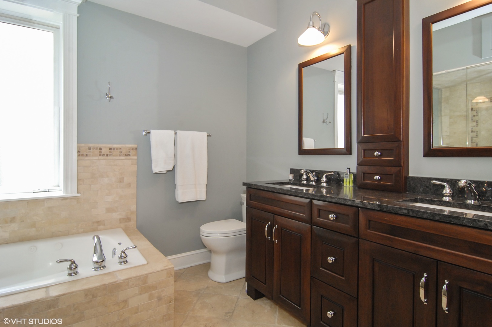 Undisclosed Address Chicago, IL 60618 - Photo 20 of 31 a bathroom with a tub sink toilet and mirror