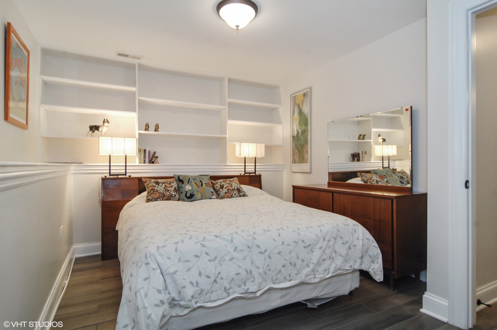 Undisclosed Address Chicago, IL 60618 - Photo 24 of 31 a bedroom with a bed and wooden floor