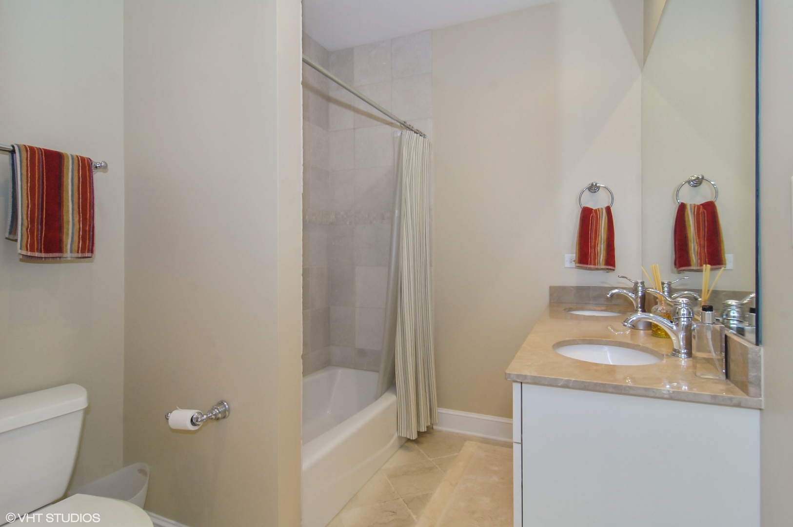 Undisclosed Address Chicago, IL 60618 - Photo 26 of 31 a bathroom with a granite countertop sink a toilet and shower