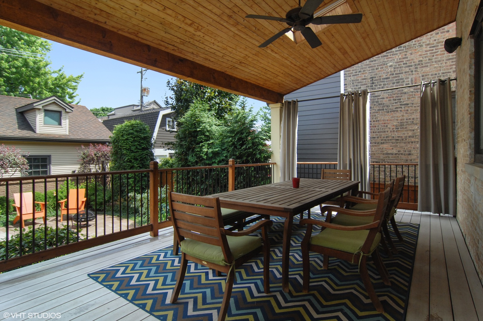 Undisclosed Address Chicago, IL 60618 - Photo 28 of 31 a view of a roof deck with table and chairs and wooden floor