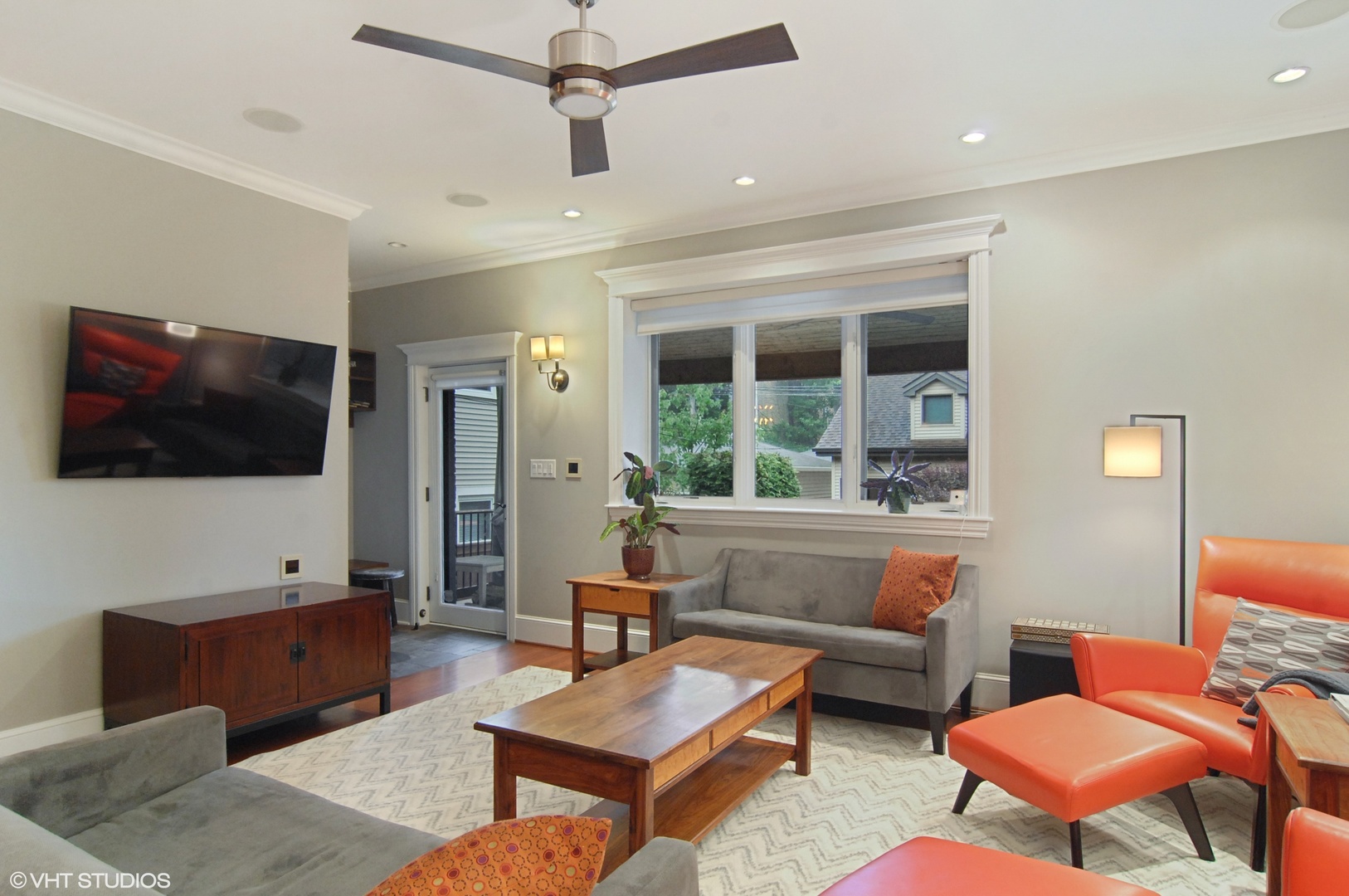 Undisclosed Address Chicago, IL 60618 - Photo 8 of 31 a living room with furniture a flat screen tv and a large window