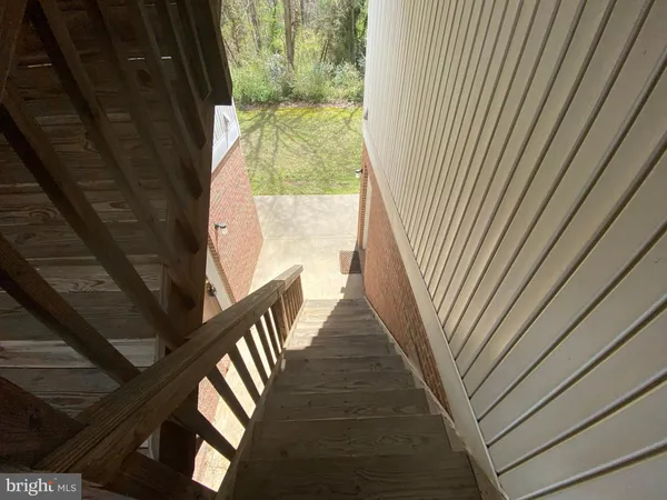 a view of balcony with wooden floor
