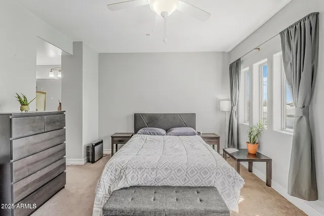 a bedroom with a bed and a dresser