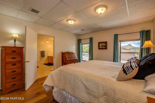 a bedroom with furniture and window