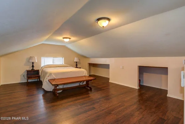 a bedroom with a bed and a cabinets