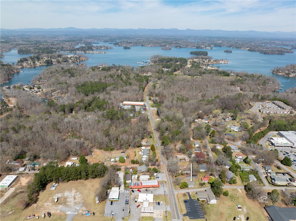 204 Old Salem Road Seneca, SC 29672 - Photo 26 of 28 This panoramic aerial captures a vibrant community nestled by a expansive lake, offering a diverse landscape.