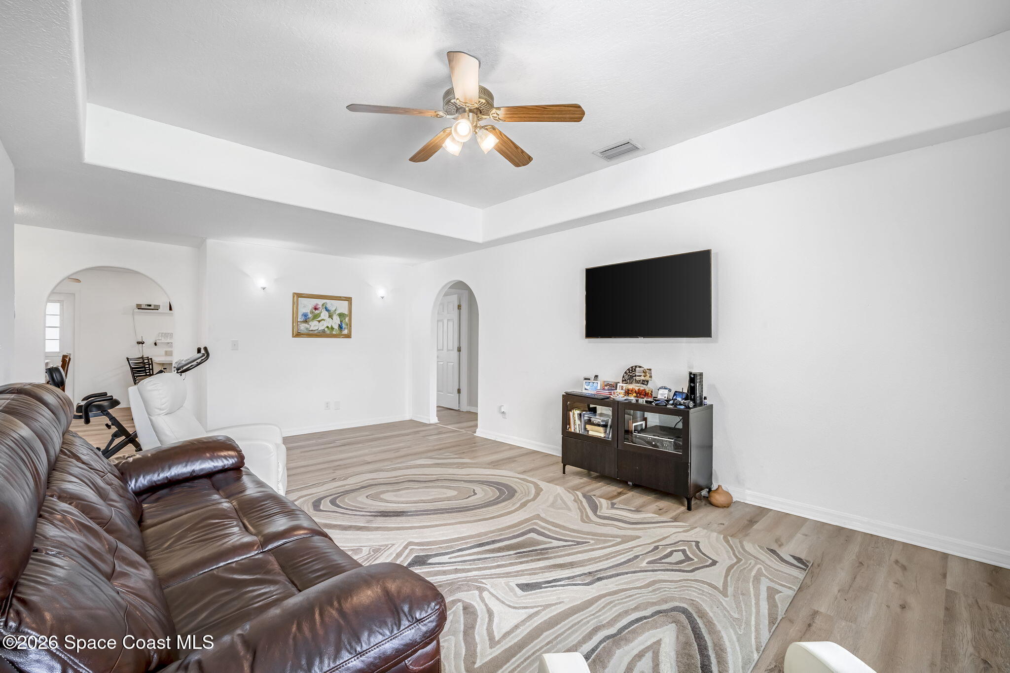 3404 Kilbee Street Mims, FL 32754 - Photo 6 of 30 a bedroom with a bed and a flat screen tv