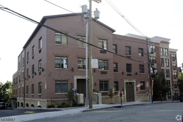 a front view of a building with a street