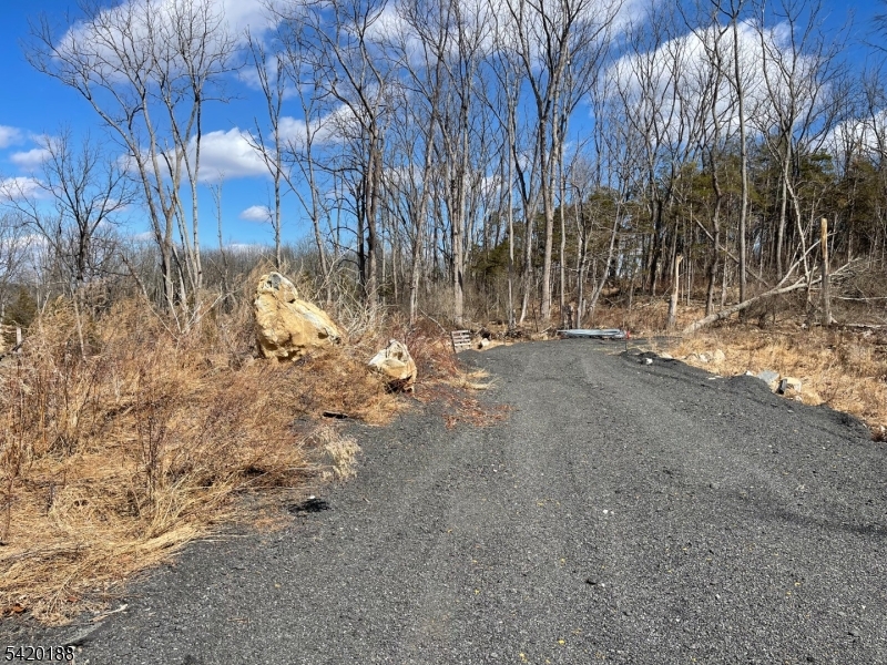 83 Creek Road Andover, NJ 07821 - Photo 12 of 12 a view of water covered with snow in between the field