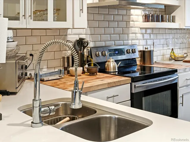 a kitchen with a sink and a stove