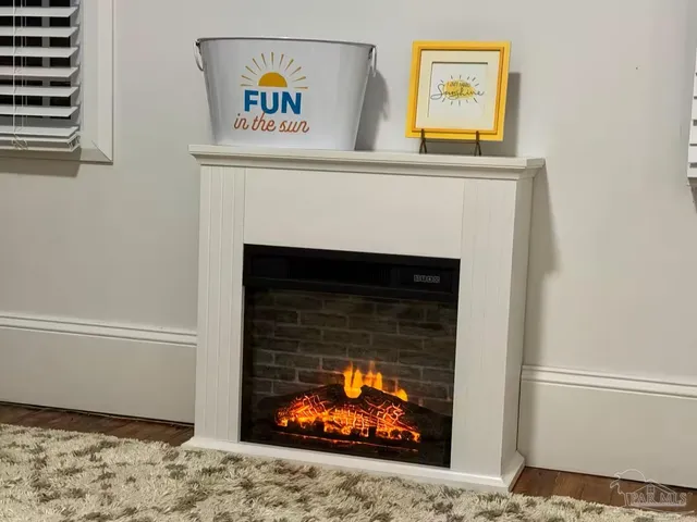 a living room with a fireplace and a fireplace