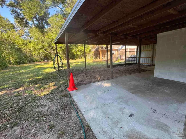 a view of a backyard with a small cabin