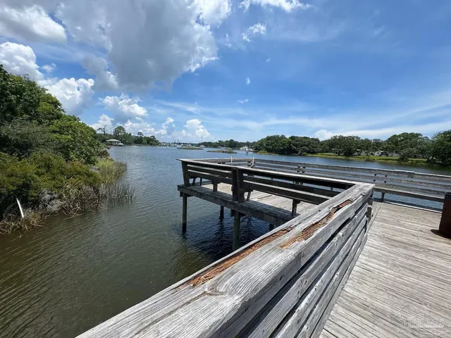 a view of a lake and yard