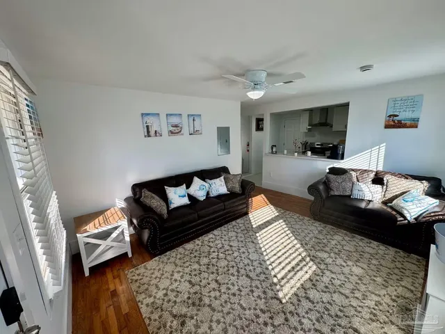 a living room with furniture and a rug