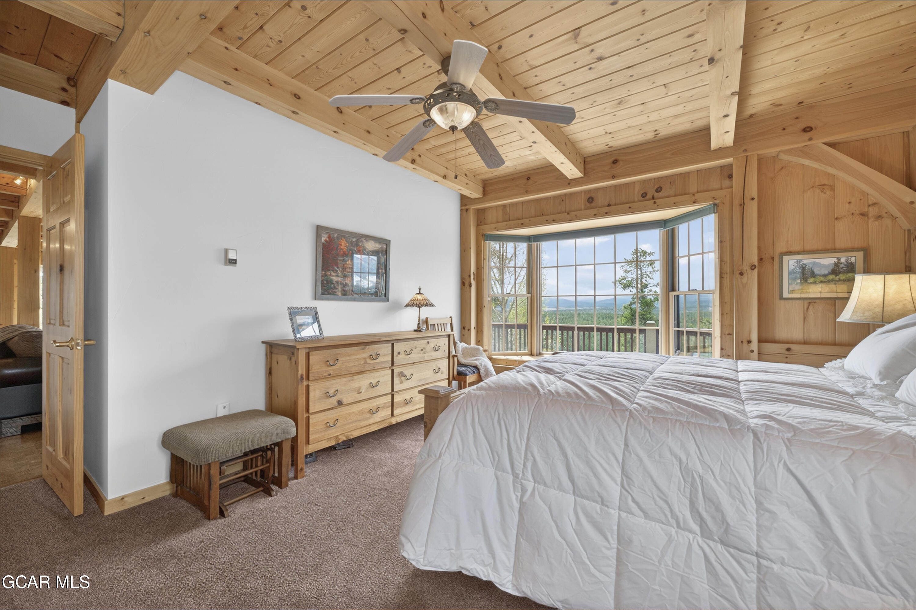 400 Ridge Road Tabernash, CO 80478 - Photo 20 of 50 a spacious bedroom with a bed and a chandelier