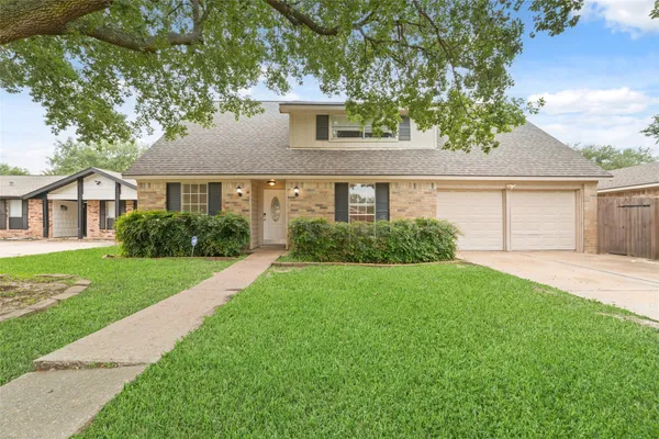 front view of a house and a yard