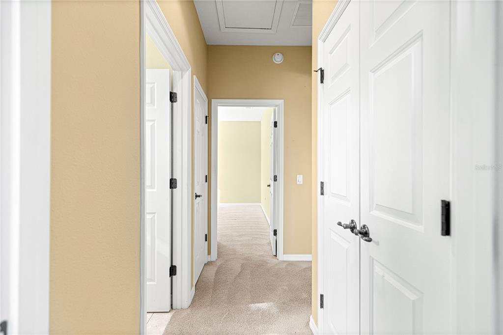 8536 Southwest 82nd Terrace Ocala, FL 34481 - Photo 19 of 47 a view of a hallway with wooden floor