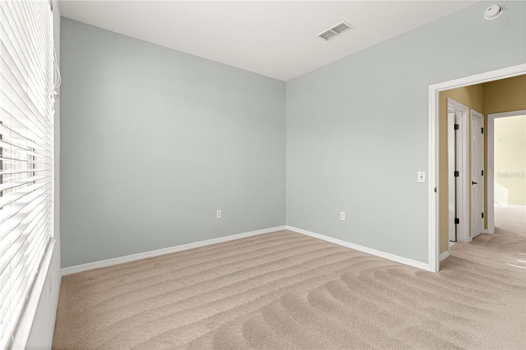 8536 Southwest 82nd Terrace Ocala, FL 34481 - Photo 25 of 47 an empty room with windows and closet