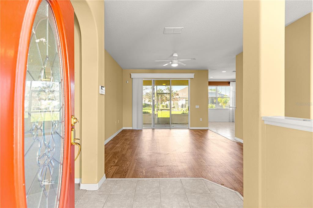 8536 Southwest 82nd Terrace Ocala, FL 34481 - Photo 3 of 47 a view of an entryway with wooden floor