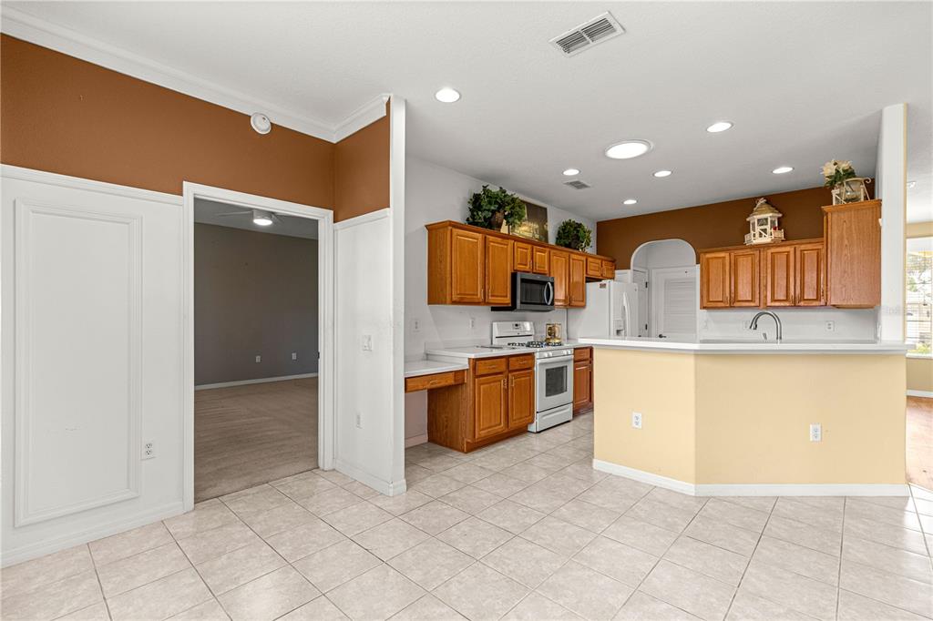 8536 Southwest 82nd Terrace Ocala, FL 34481 - Photo 33 of 47 a kitchen with stainless steel appliances granite countertop a refrigerator and a sink