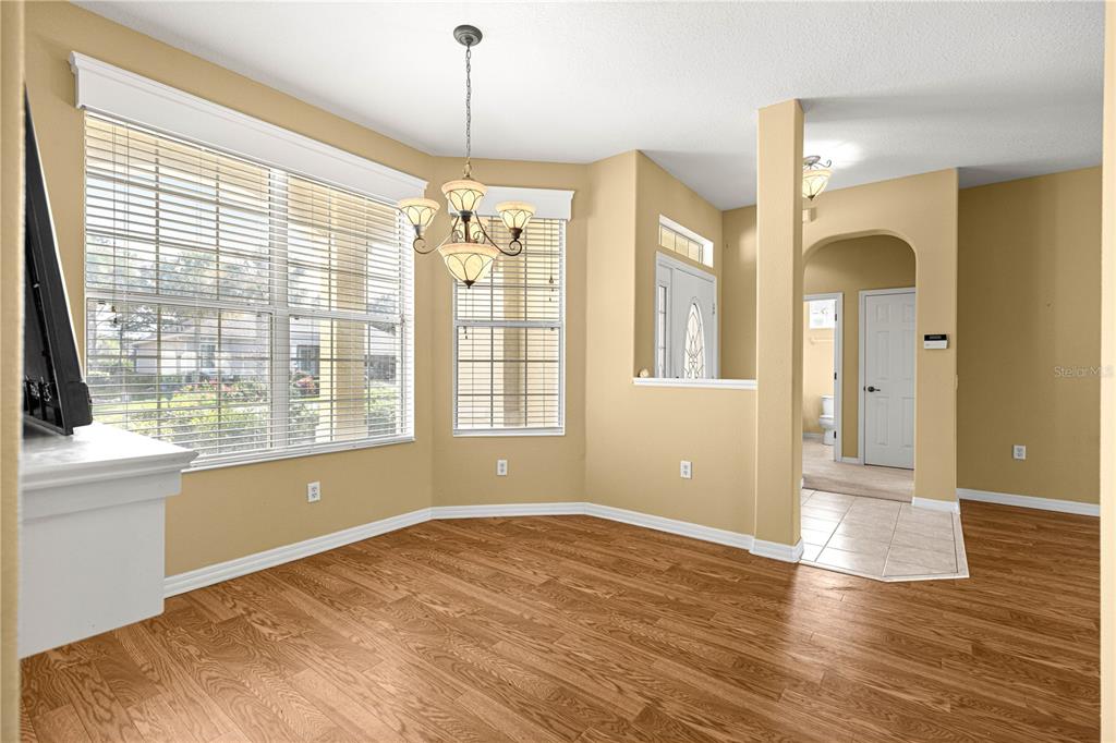 8536 Southwest 82nd Terrace Ocala, FL 34481 - Photo 34 of 47 a view of empty room with wooden floor and fan