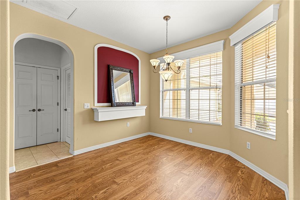 8536 Southwest 82nd Terrace Ocala, FL 34481 - Photo 35 of 47 a view of an empty room with a window and wooden floor