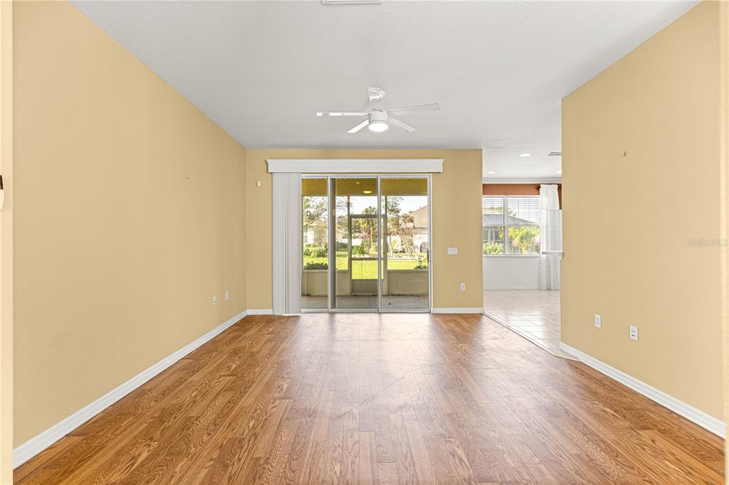 8536 Southwest 82nd Terrace Ocala, FL 34481 - Photo 37 of 47 wooden floor in an empty room with a window