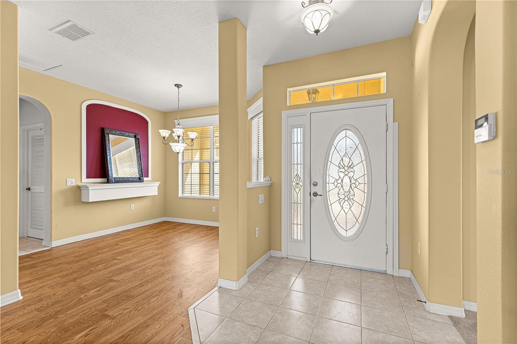 8536 Southwest 82nd Terrace Ocala, FL 34481 - Photo 4 of 47 a view of a hallway with wooden floor