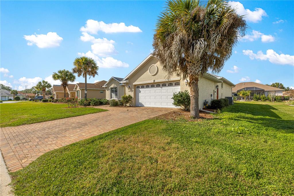 8536 Southwest 82nd Terrace Ocala, FL 34481 - Photo 43 of 47 a white house with a big yard plants and large trees