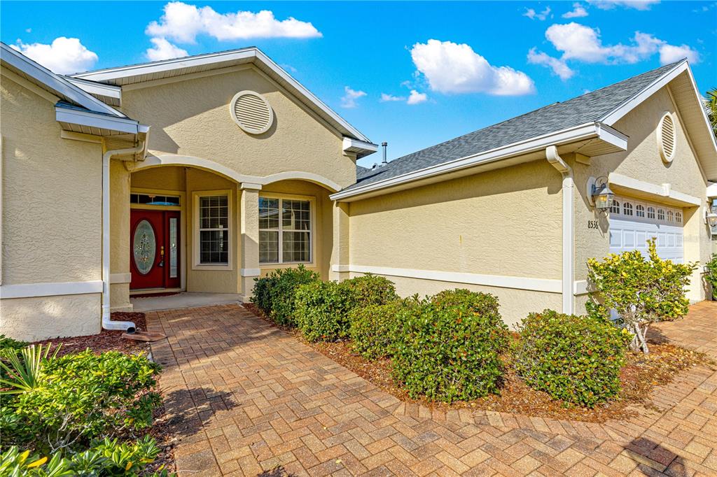 8536 Southwest 82nd Terrace Ocala, FL 34481 - Photo 47 of 47 a front view of a house with plants
