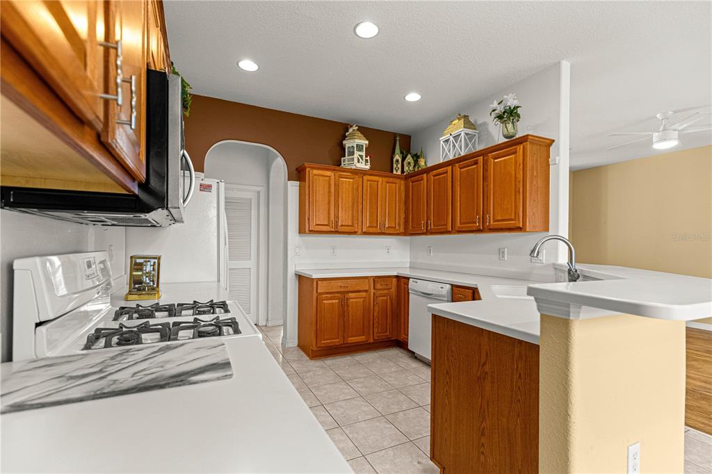 8536 Southwest 82nd Terrace Ocala, FL 34481 - Photo 10 of 47 a kitchen with stainless steel appliances granite countertop a sink stove and refrigerator
