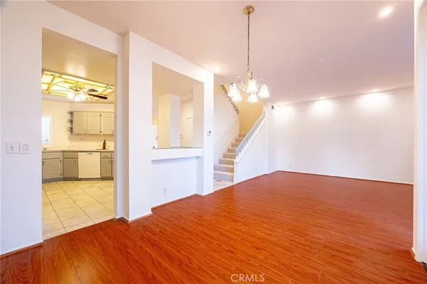 a kitchen with cabinets stainless steel appliances and window