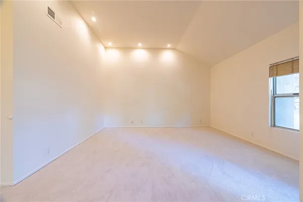 a spacious bathroom with a double vanity sink a mirror and a shower