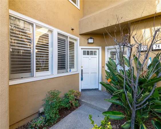 a house with a plant in front of it