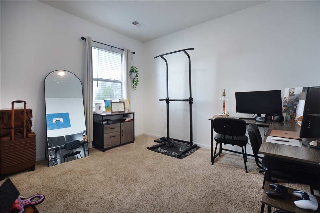 242 Hillendale Way Pelzer, SC 29669 - Photo 7 of 19 This versatile room features plush carpeting and a large window, offering a bright and functional living space.