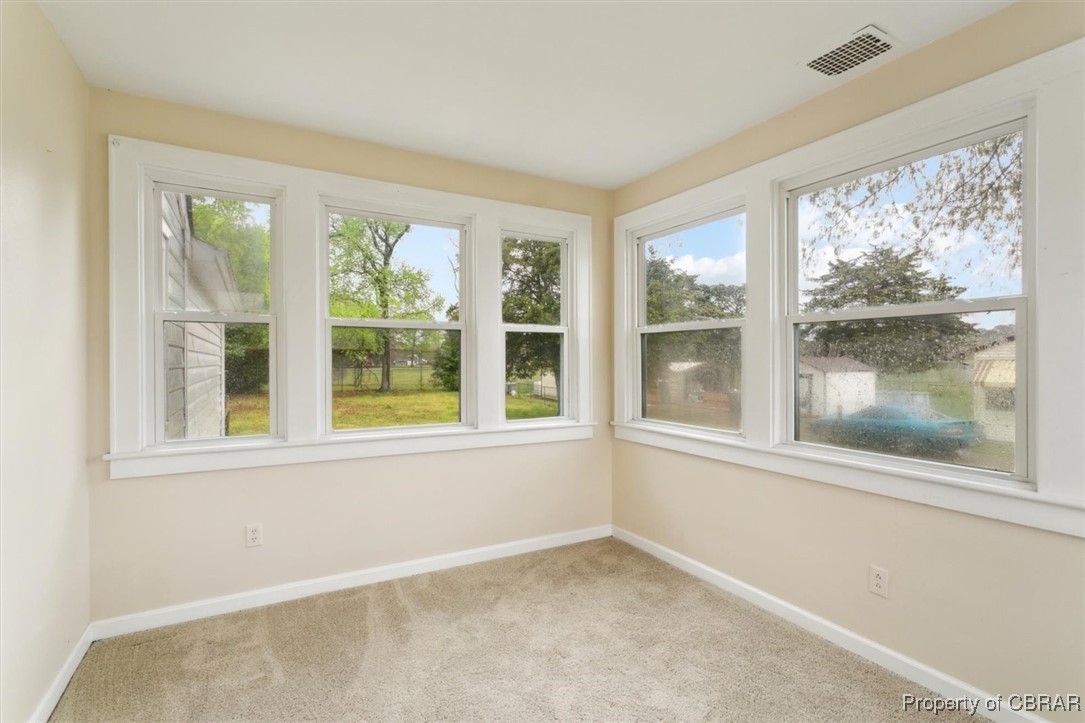 345 Fox Hill Road Hampton, VA 23669 - Photo 32 of 46 Carpeted empty room with baseboards, visible vents, and plenty of natural light