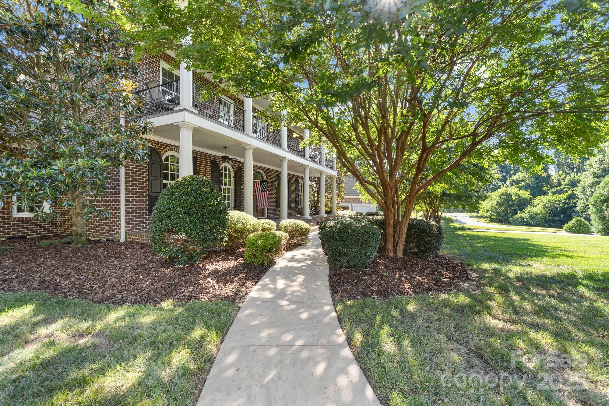 200 Galey Ridge Cramerton, NC 28032 - Photo 2 of 48 a front view of a house with a garden