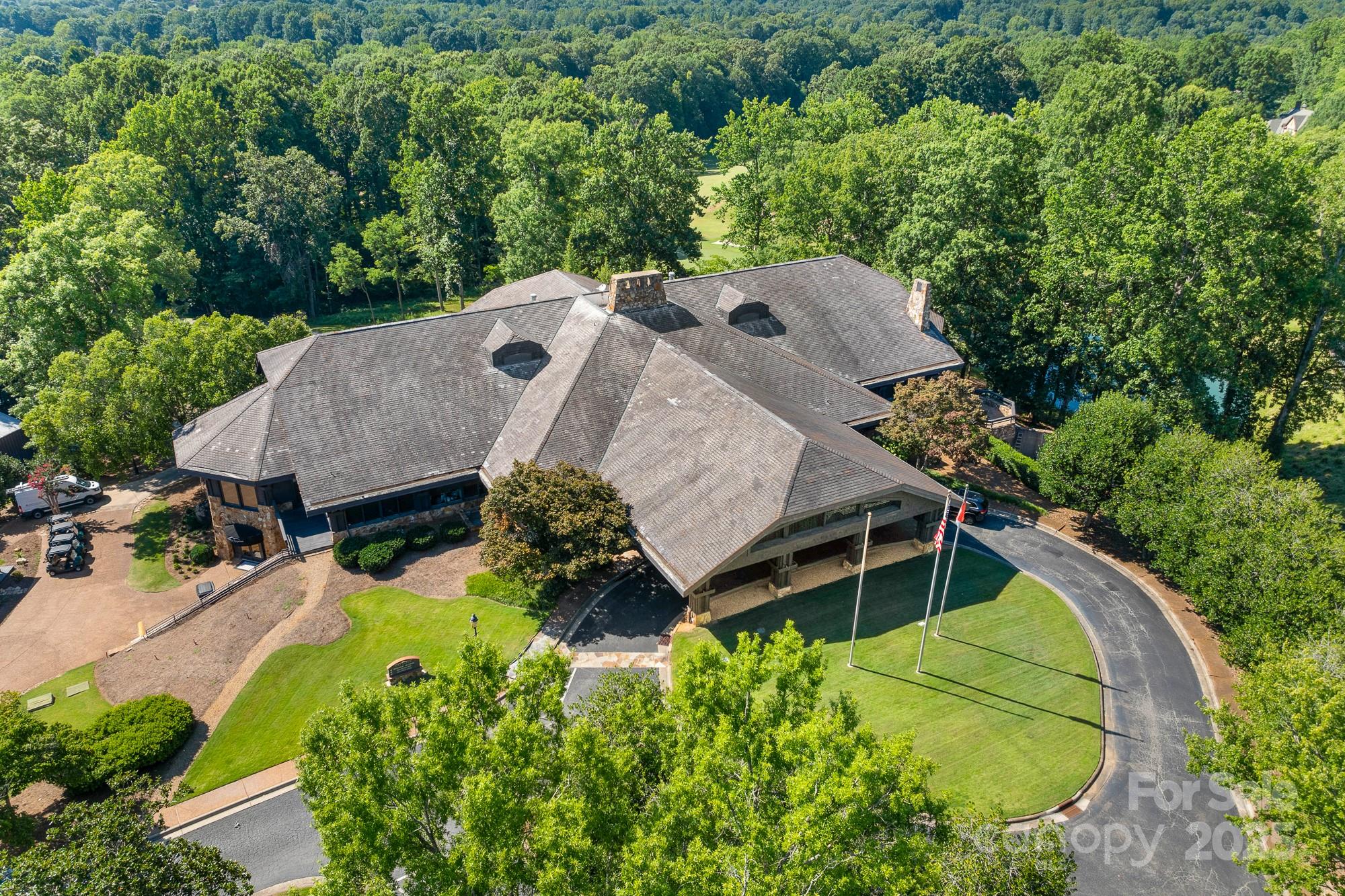 200 Galey Ridge Cramerton, NC 28032 - Photo 42 of 48 an aerial view of a house with a big yard and large trees