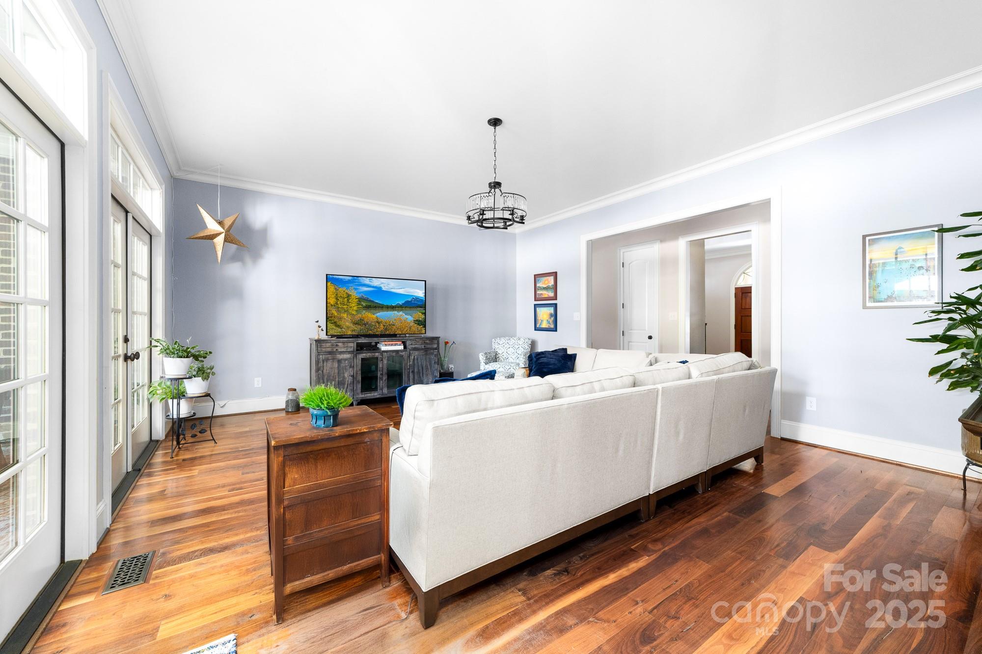 200 Galey Ridge Cramerton, NC 28032 - Photo 7 of 48 a living room with furniture and a chandelier