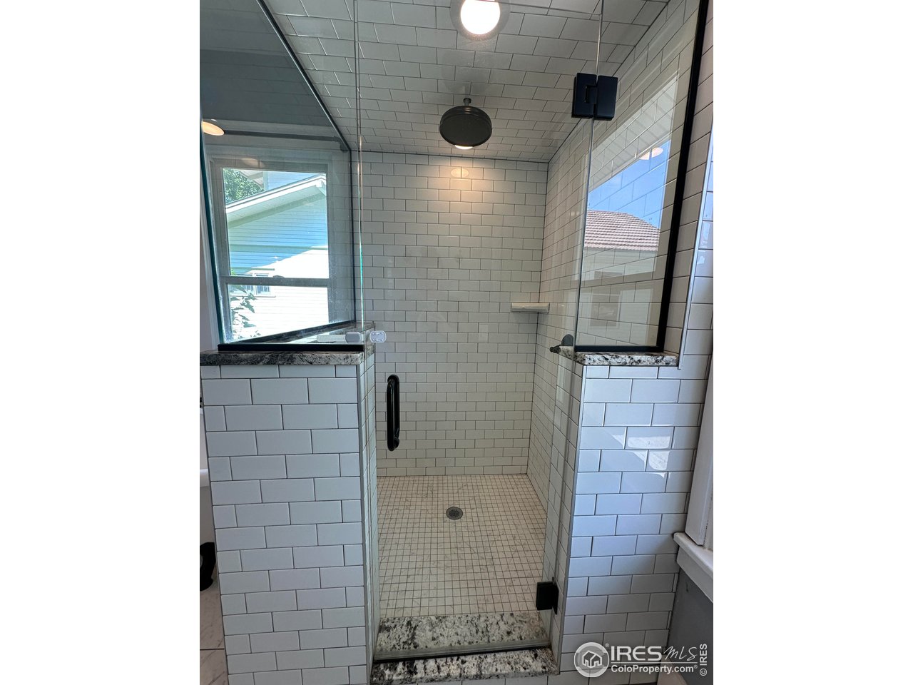 302 Beattie Street Sterling, CO 80751 - Photo 18 of 30 a bathroom with a shower