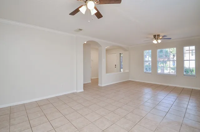 a kitchen with granite countertop white cabinets and stainless steel appliances