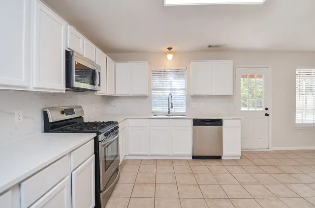 a view of a livingroom with a staircase