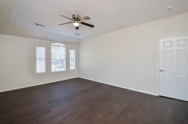 a white bath tub sitting next to a window