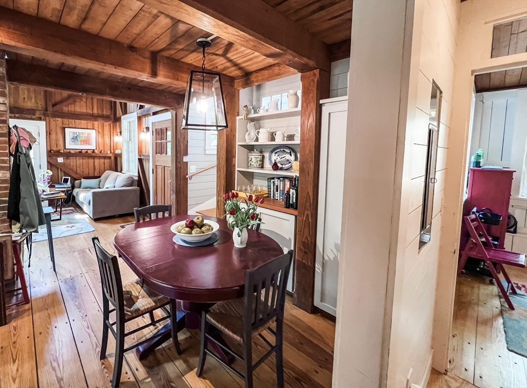 225 Lamberts Cove Road West Tisbury, MA 02568 - Photo 18 of 33 a view of a dining room with furniture and chandelier