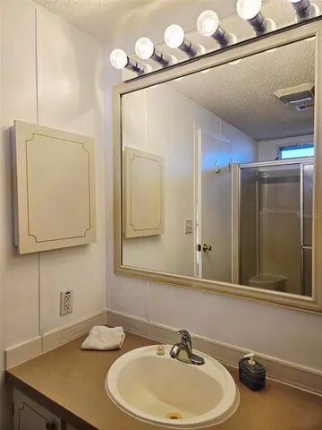 a white toilet sitting next to a bath tub