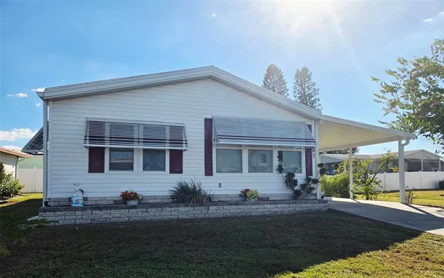 a view of a backyard of the house