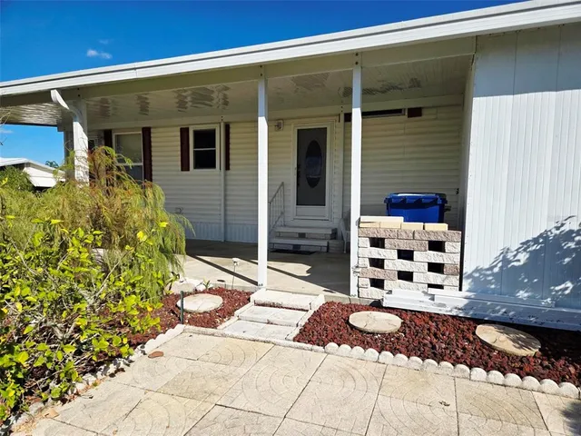a view of a livingroom with furniture and windows